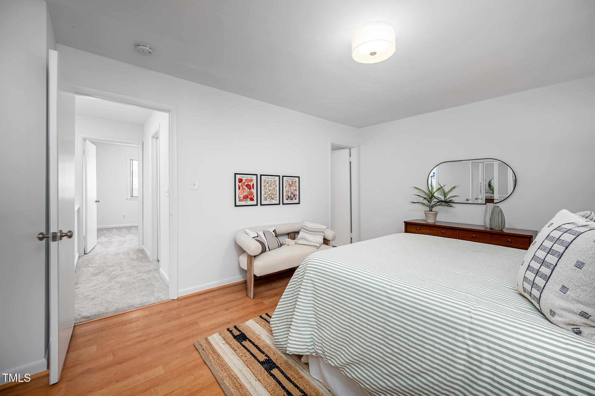 906 Oak Tree Drive Chapel Hill, NC 27517 - Photo 12 of 22 a bedroom with bed and wooden floor