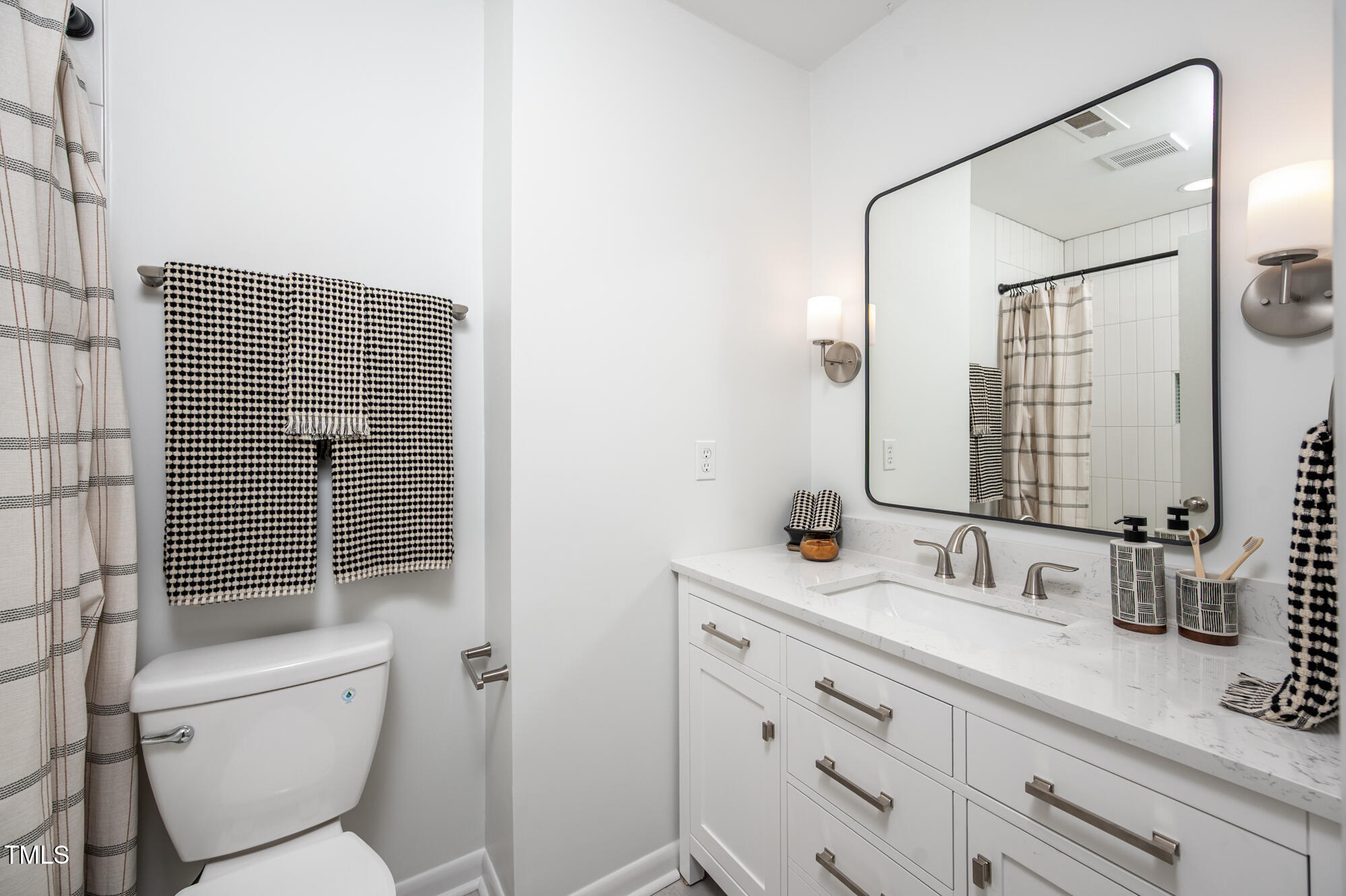 906 Oak Tree Drive Chapel Hill, NC 27517 - Photo 14 of 22 a bathroom with a sink a toilet and shower