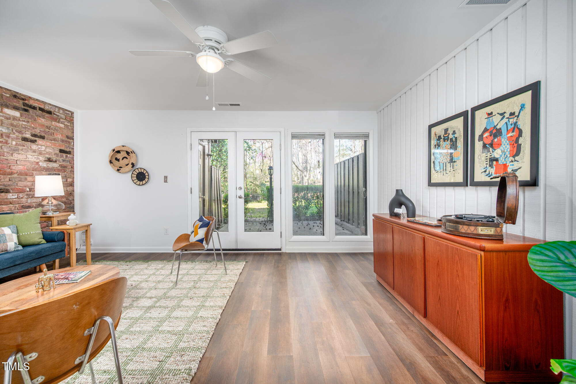 906 Oak Tree Drive Chapel Hill, NC 27517 - Photo 5 of 22 a living room with furniture a large window with wooden floor
