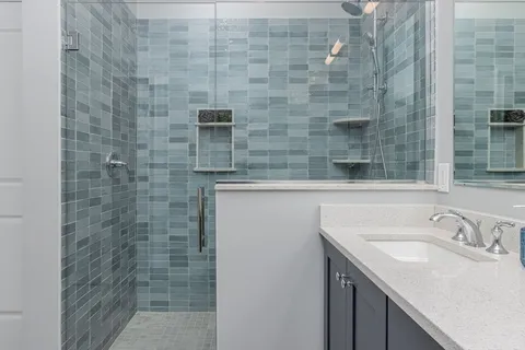 a bathroom with a sink and a shower