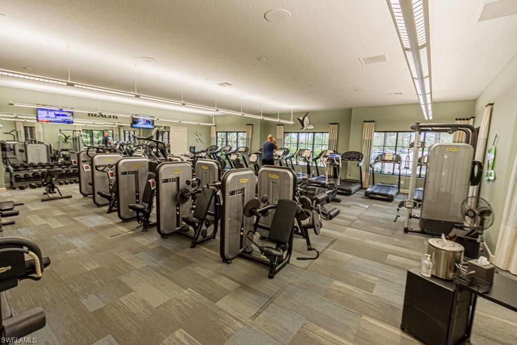9378 Pocida Court, Unit 202 Naples, FL 34119 - Photo 38 of 41 a view of a room with gym equipment