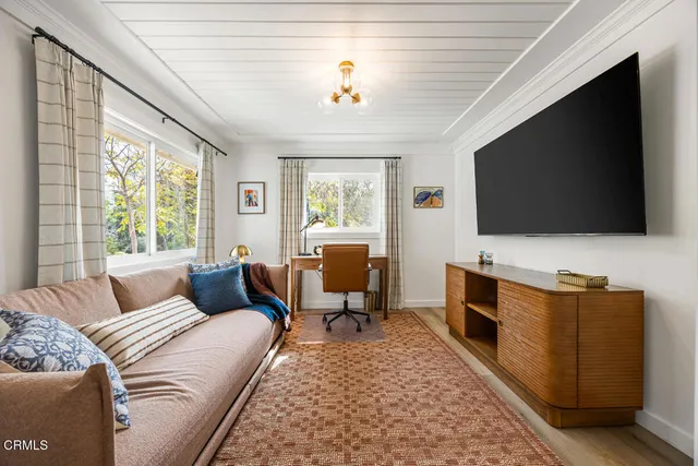 a bedroom with a bed and a fireplace