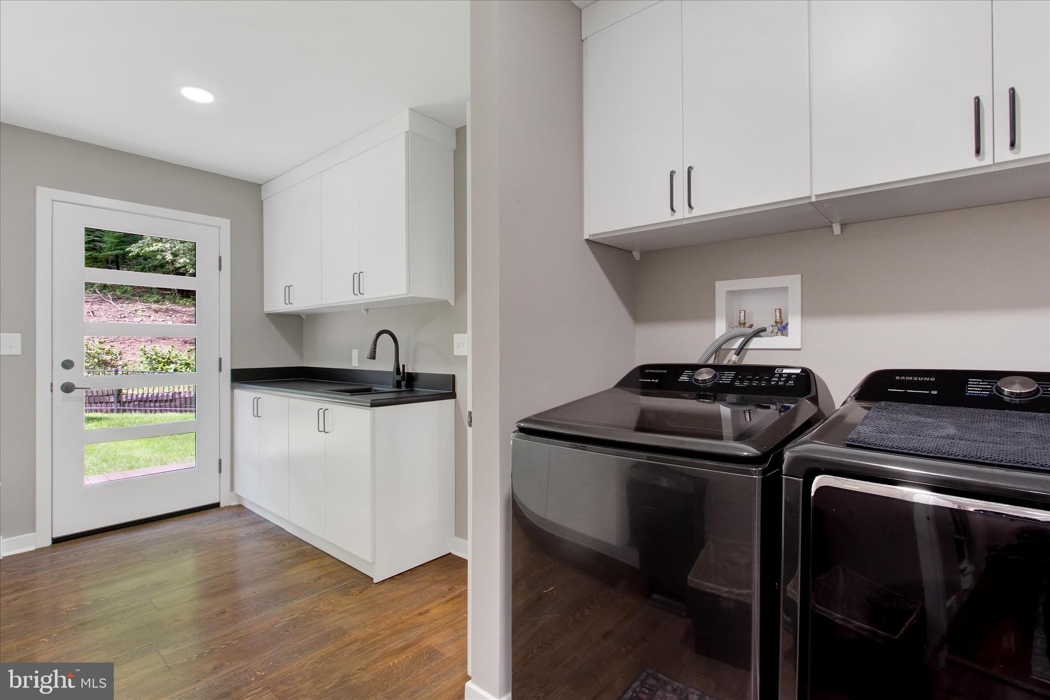 1855 Westwood Road York, PA 17403 - Photo 30 of 60 a kitchen with appliances cabinets and a wooden floor