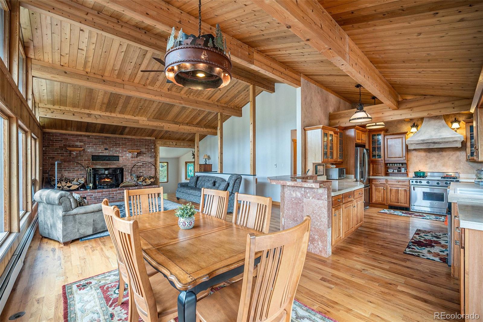 1774 Upper Bear Creek Road Evergreen, CO 80439 - Photo 11 of 43 a view of a dining room with furniture