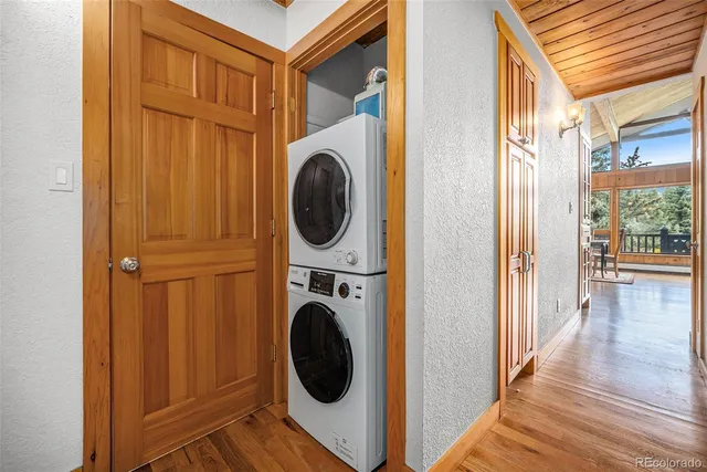a view of a hallway with washer and dryer