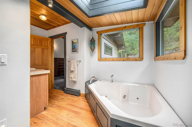 a bathroom with a tub and sink