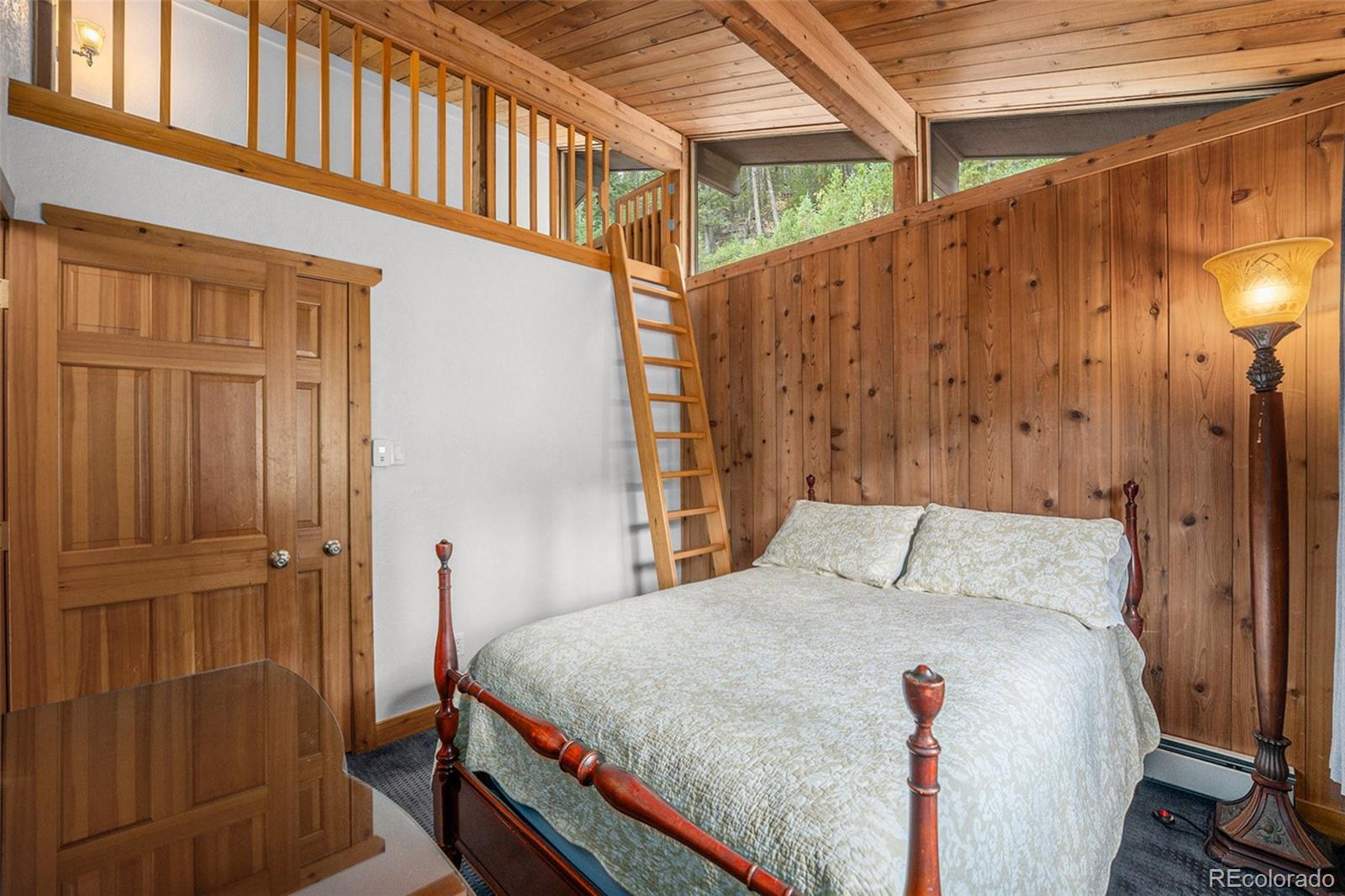 1774 Upper Bear Creek Road Evergreen, CO 80439 - Photo 21 of 43 a bed room with a bed