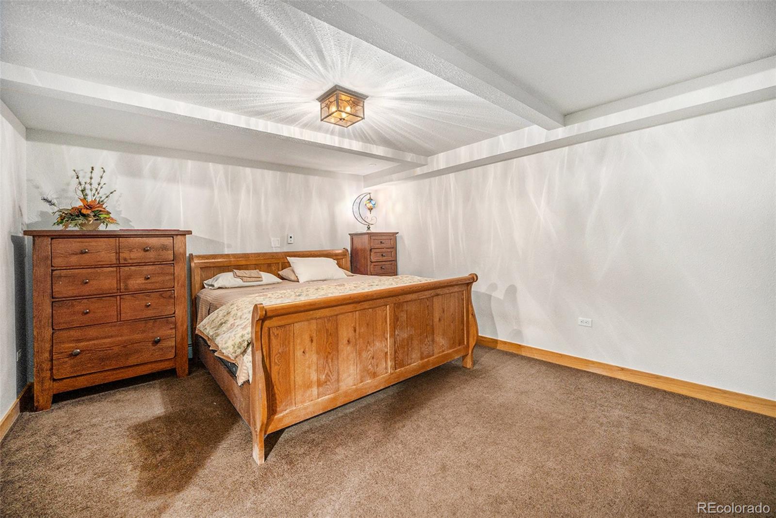 1774 Upper Bear Creek Road Evergreen, CO 80439 - Photo 28 of 43 a bed room with a bed and a window