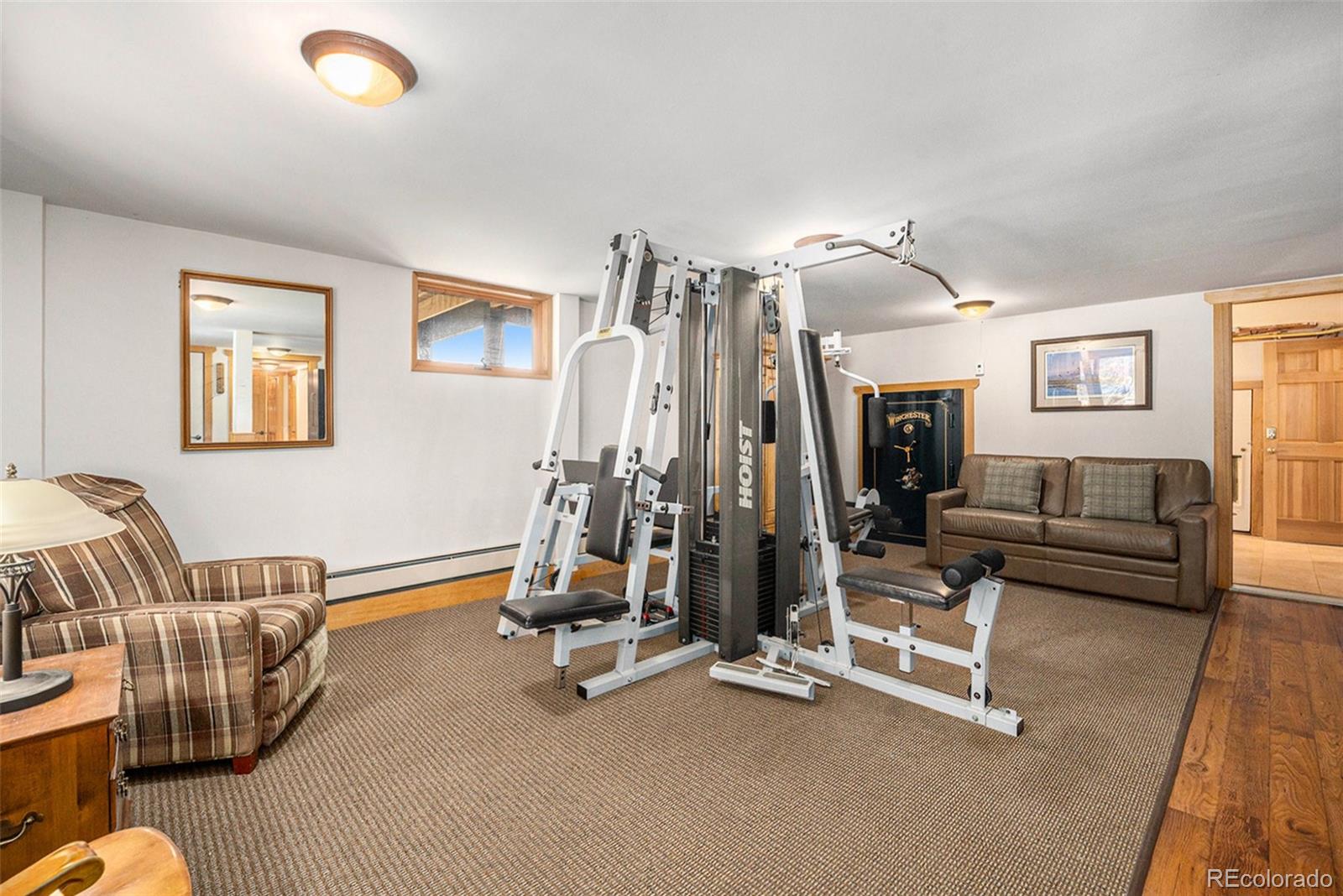 1774 Upper Bear Creek Road Evergreen, CO 80439 - Photo 31 of 43 a view of a livingroom with furniture and windows