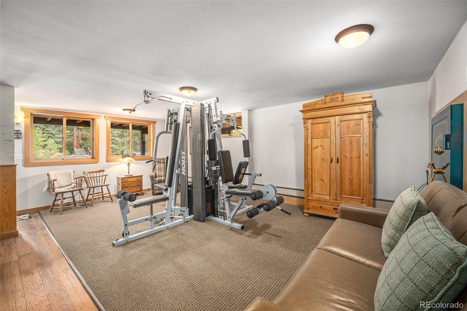 1774 Upper Bear Creek Road Evergreen, CO 80439 - Photo 32 of 43 a view of a livingroom with furniture and windows