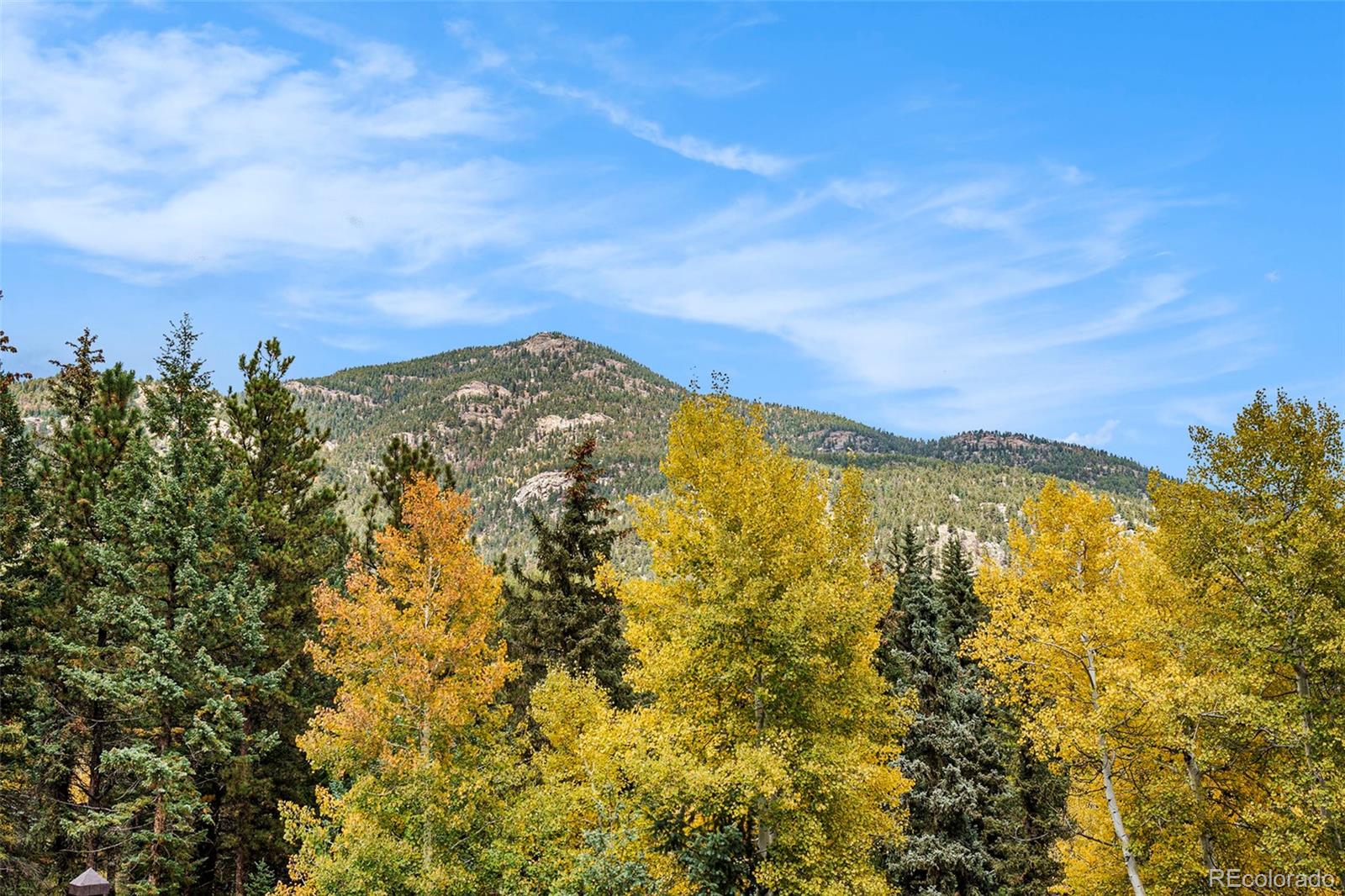 1774 Upper Bear Creek Road Evergreen, CO 80439 - Photo 38 of 43 a view of a large body of water with a building in the background