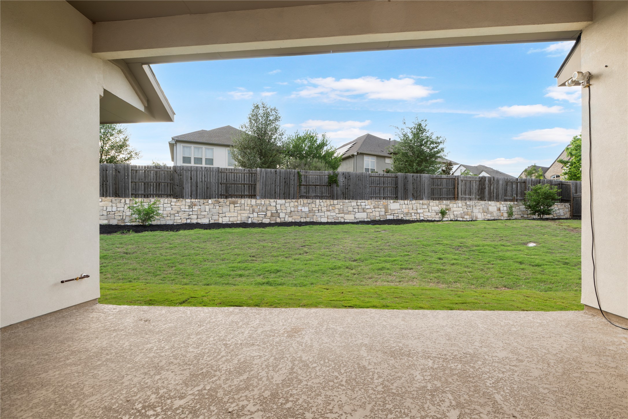 104 Catani Loop Georgetown, TX 78628 - Photo 12 of 34 A spacious backyard with mature landscaping and a private fence creates an ideal outdoor sanctuary.