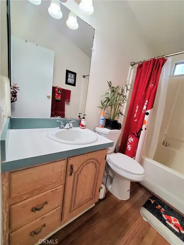 a bathroom with a sink toilet and mirror
