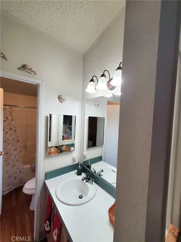 a bathroom with a sink double vanity granite and a mirror