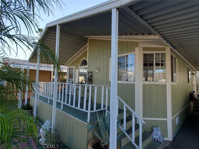 a view of balcony with deck and outdoor seating