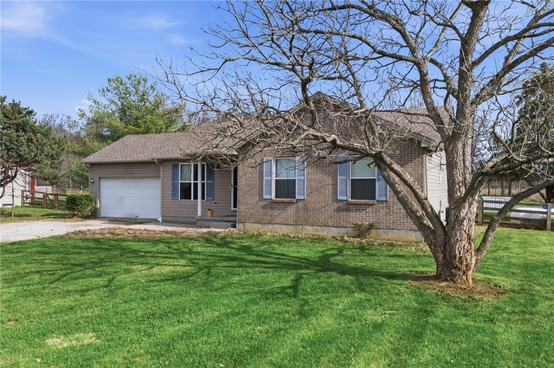 8747 Waynes Way Blanchester, OH 45107 - Photo 29 of 40 This charming residence features a well-maintained exterior with classic brick accents.