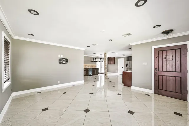 a modern kitchen with stainless steel appliances granite countertop a stove sink and refrigerator