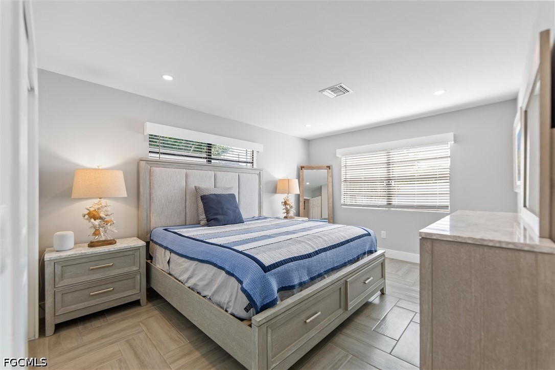 1200 Patterson Road Cape Coral, FL 33909 - Photo 17 of 42 a bedroom with a bed and window