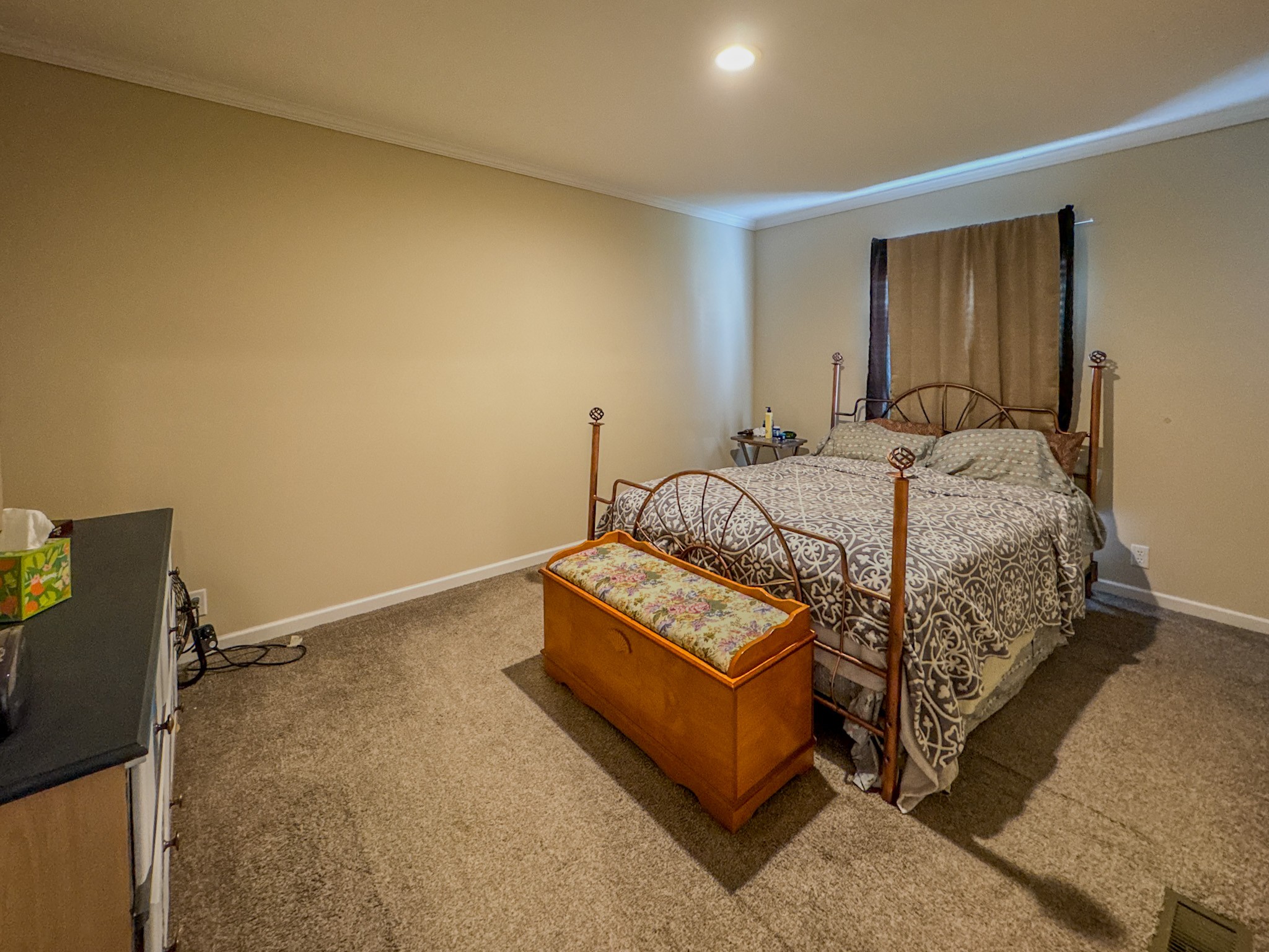 1198 David Patterson Road Lutts, TN 38471 - Photo 30 of 82 a bed sitting in a spacious bedroom next to a window