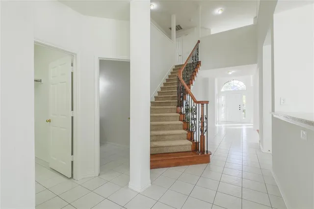 a view of entryway and hall with a front door