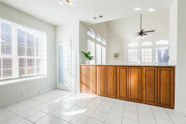 a view of an entryway with a chandelier fan