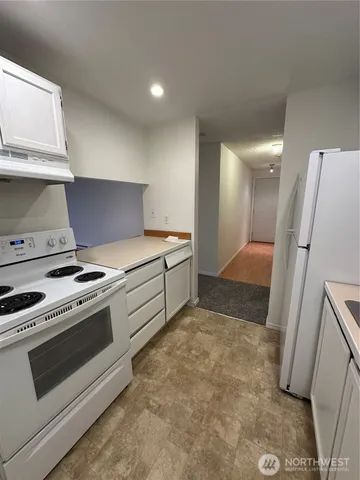 a kitchen with a stove and a sink