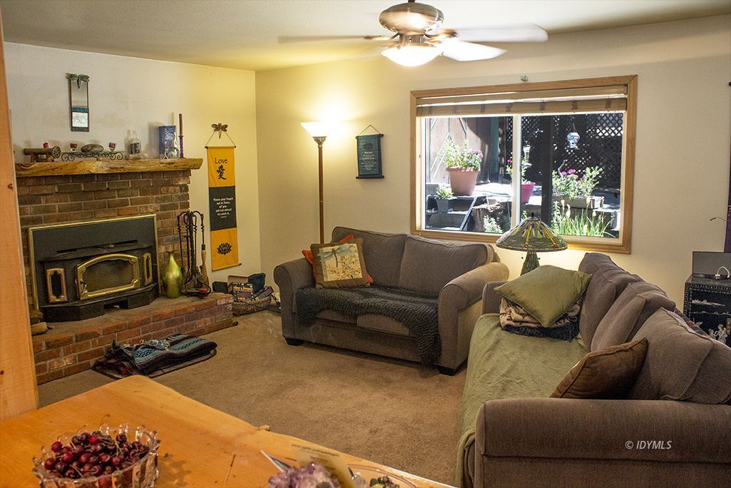 25091 Rim Rock Road Idyllwild, CA 92549 - Photo 7 of 15 a living room with furniture and a fireplace