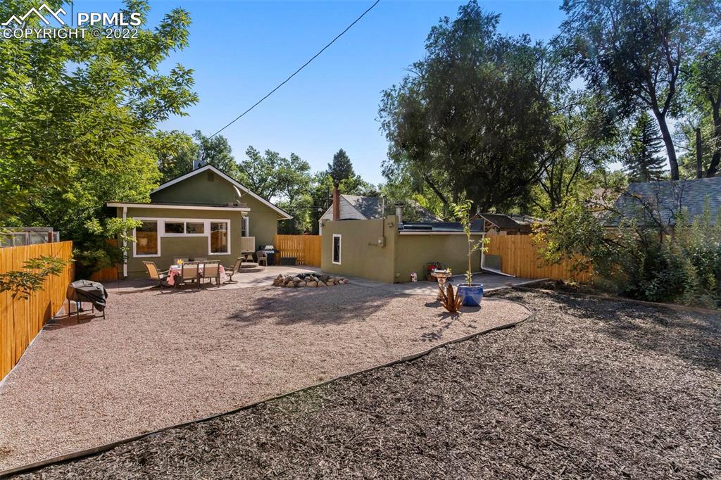 6 Alsace Way Colorado Springs, CO 80906 - Photo 21 of 30 a table and chairs in front of house