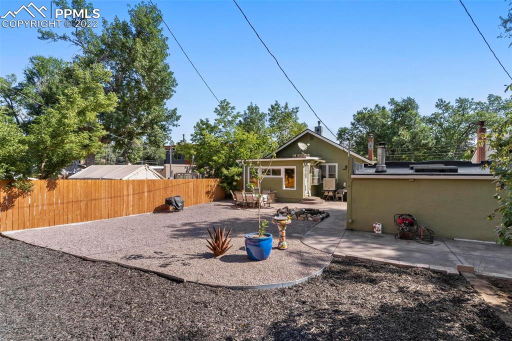 6 Alsace Way Colorado Springs, CO 80906 - Photo 22 of 30 a backyard of a house with table and chairs