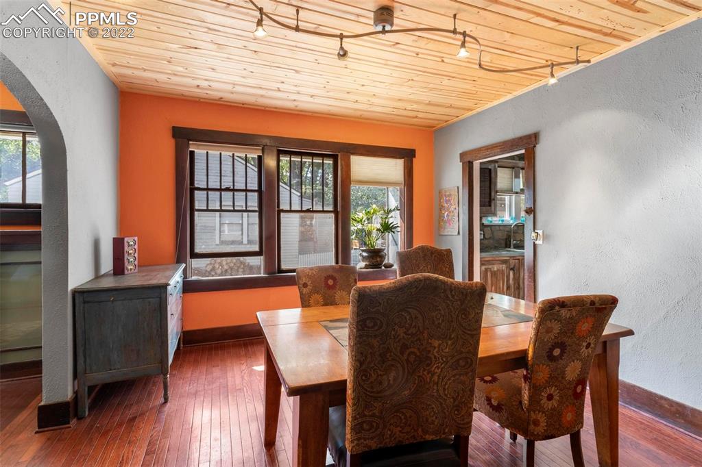 6 Alsace Way Colorado Springs, CO 80906 - Photo 5 of 30 a dining room with furniture and wooden floor