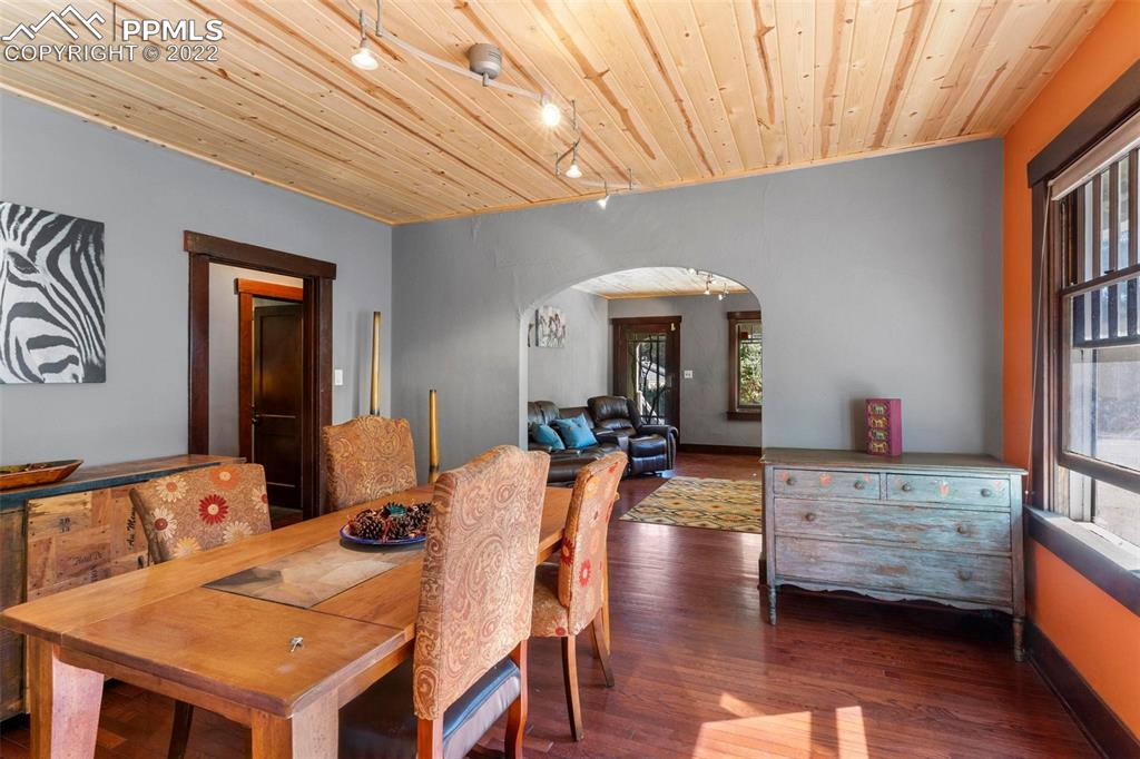 6 Alsace Way Colorado Springs, CO 80906 - Photo 6 of 30 a view of a dining room with furniture window and wooden floor