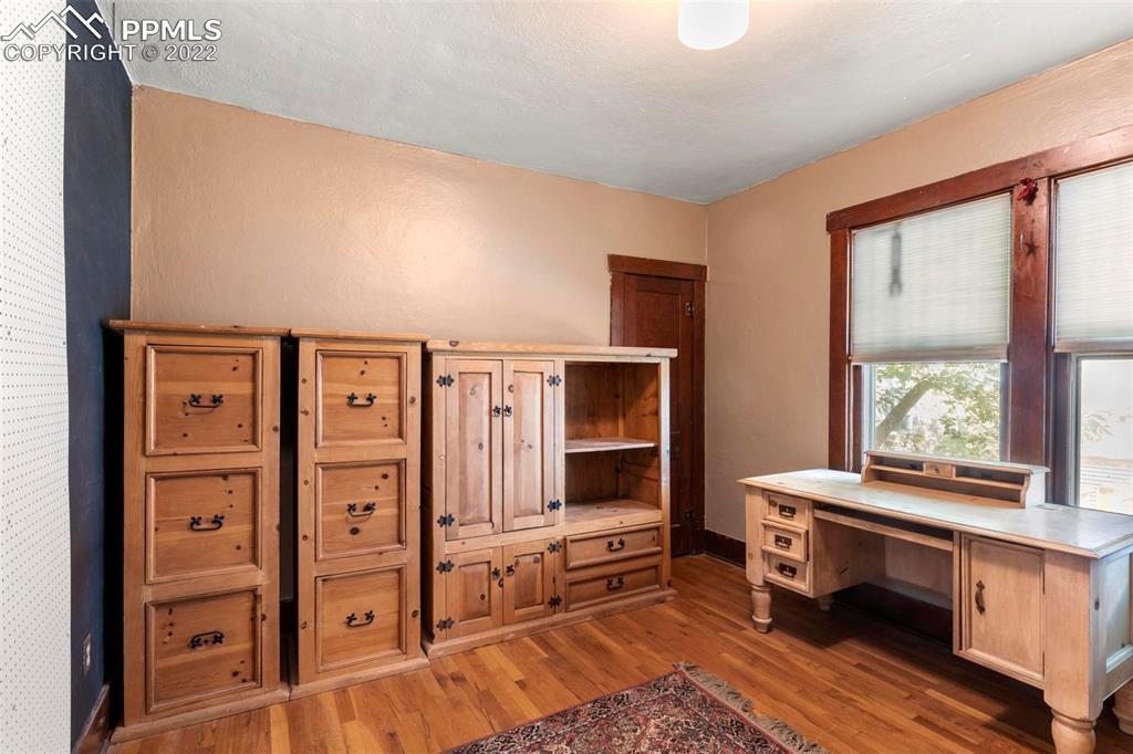 6 Alsace Way Colorado Springs, CO 80906 - Photo 9 of 30 a bedroom with furniture and window
