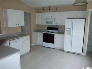 9215 Hillston Ridge Road Huntersville, NC 28078 - Photo 4 of 14 a kitchen with cabinets appliances and a sink