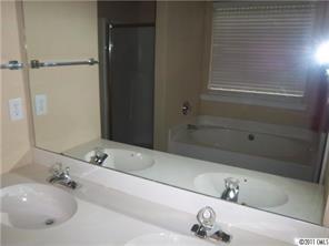 9215 Hillston Ridge Road Huntersville, NC 28078 - Photo 9 of 14 a bathroom with a tub and a sink