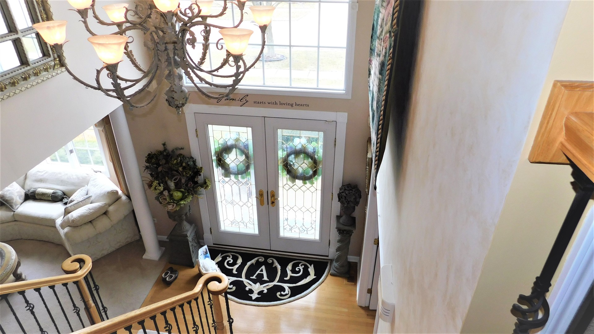 13243 Sunderlin Road Plainfield, IL 60585 - Photo 12 of 40 a view of a balcony with furniture and front door