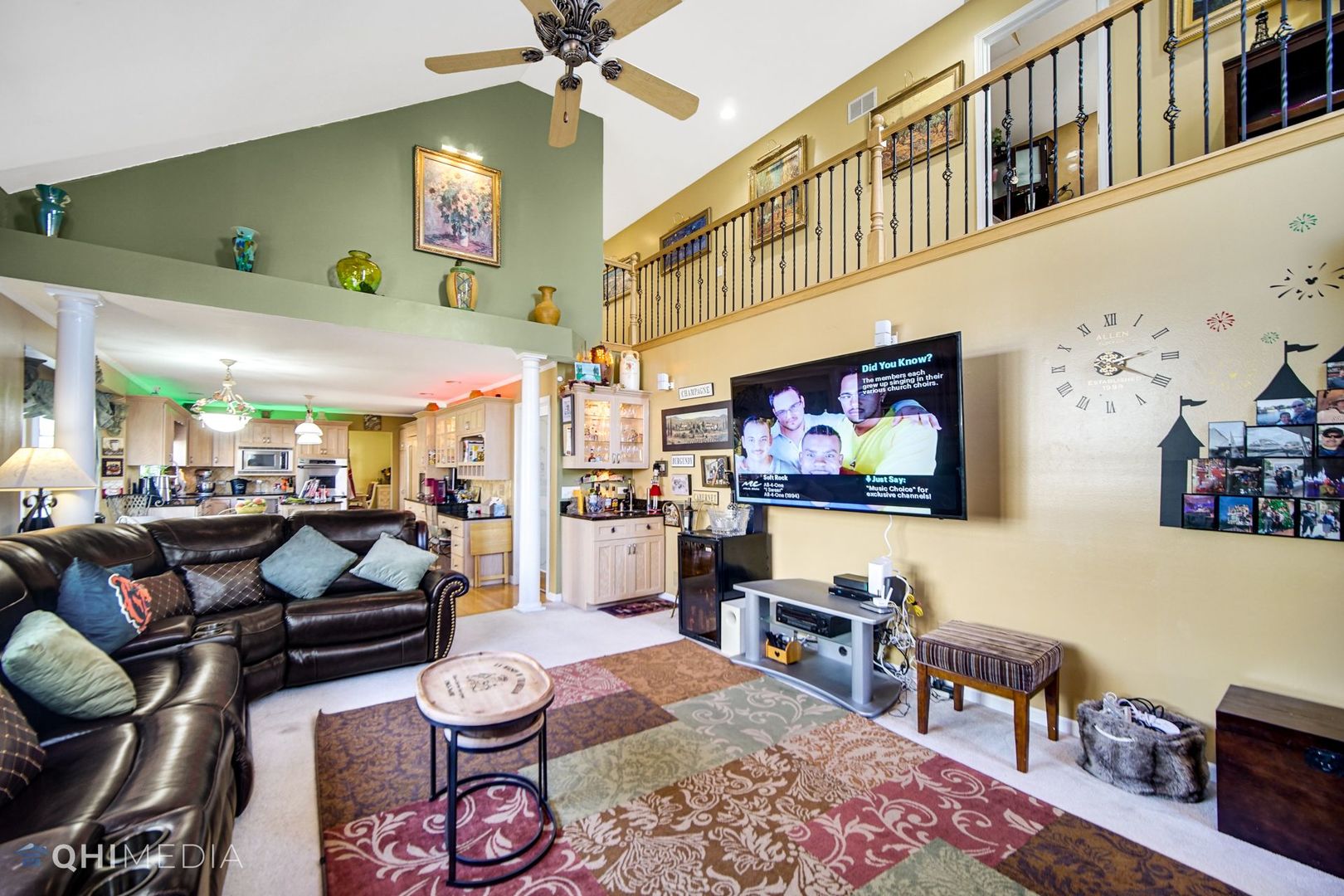 13243 Sunderlin Road Plainfield, IL 60585 - Photo 18 of 40 a living room with furniture and a flat screen tv
