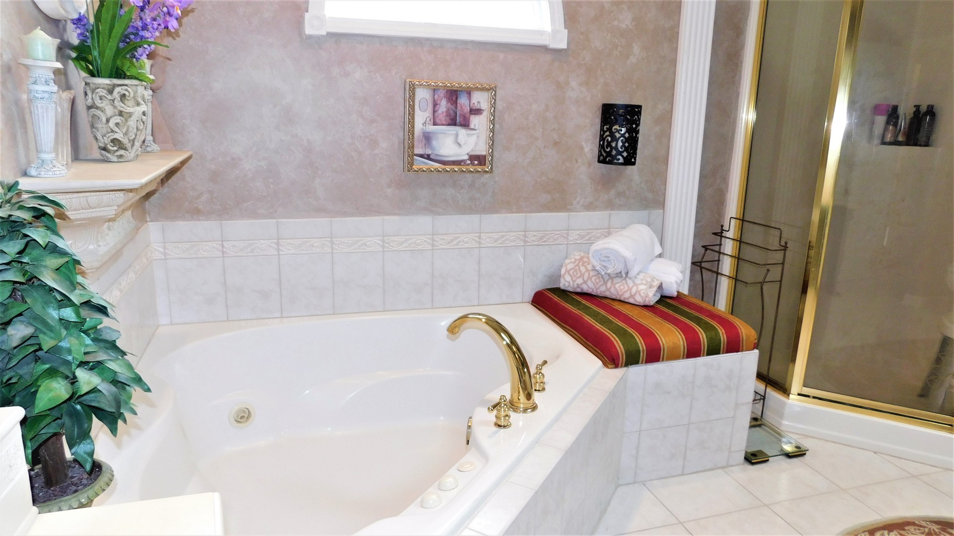 13243 Sunderlin Road Plainfield, IL 60585 - Photo 21 of 40 a bathroom with a tub and shower