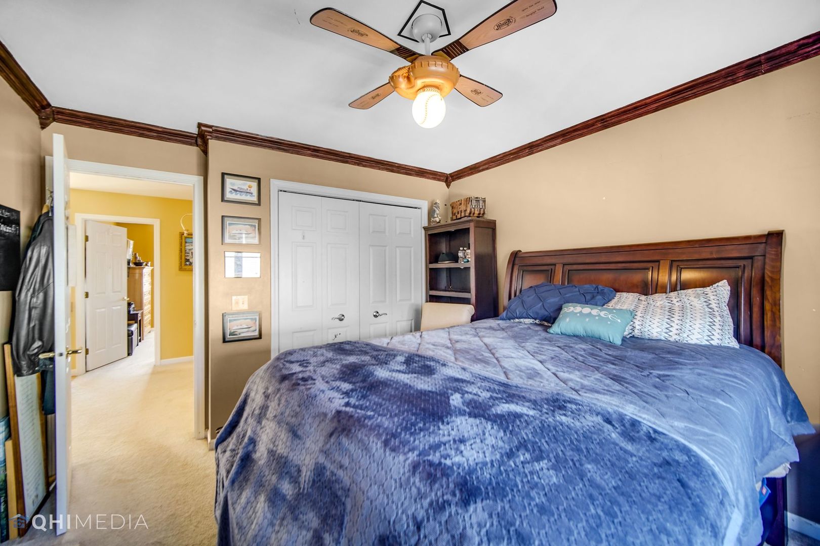 13243 Sunderlin Road Plainfield, IL 60585 - Photo 24 of 40 a large bedroom with a large bed and a chandelier