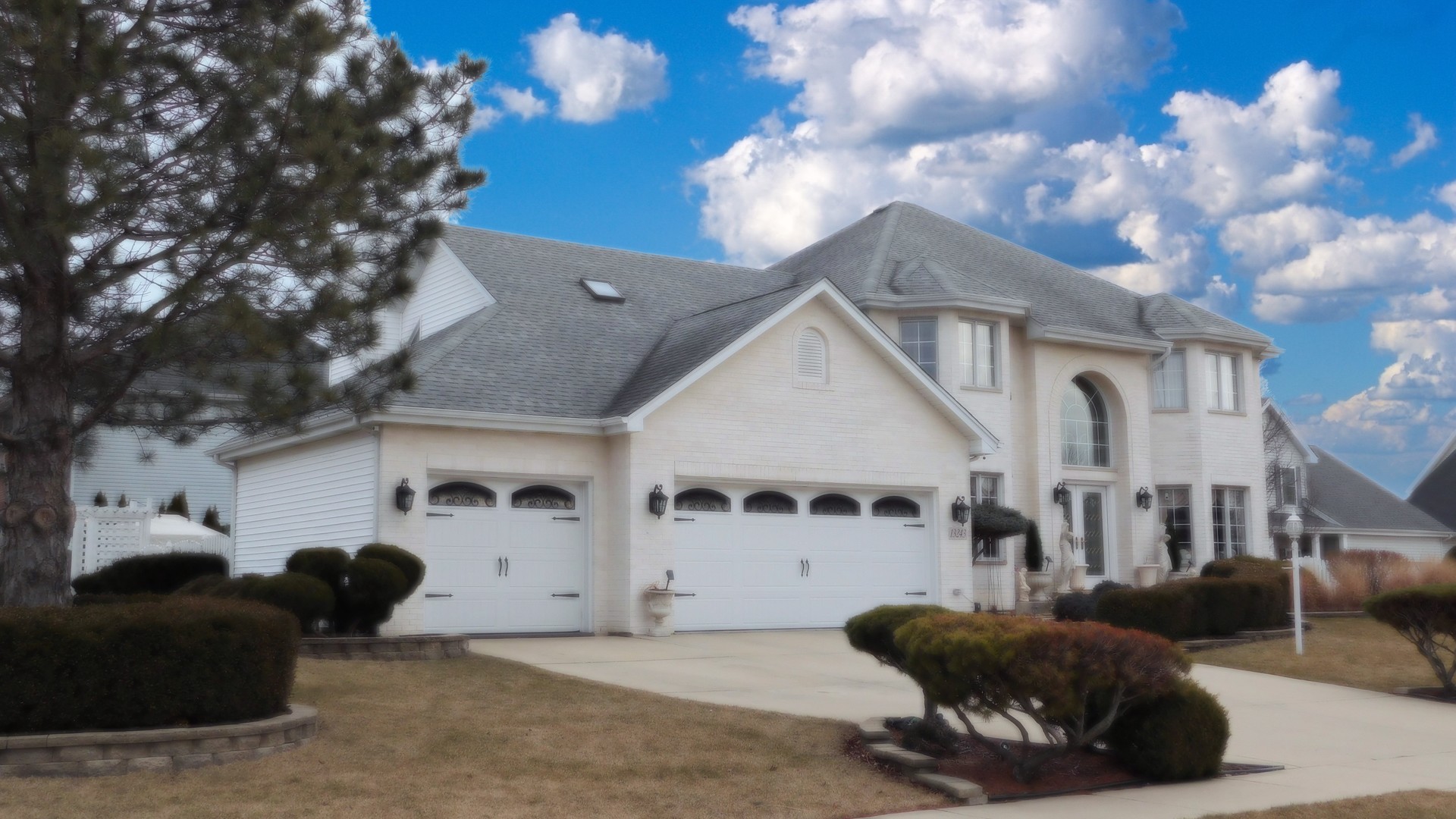 13243 Sunderlin Road Plainfield, IL 60585 - Photo 3 of 40 a view of a white house with a large tree in front of it