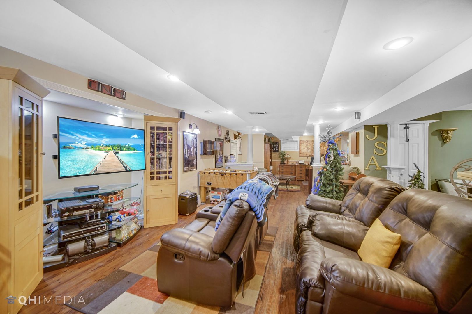 13243 Sunderlin Road Plainfield, IL 60585 - Photo 32 of 40 a living room with furniture and a flat screen tv