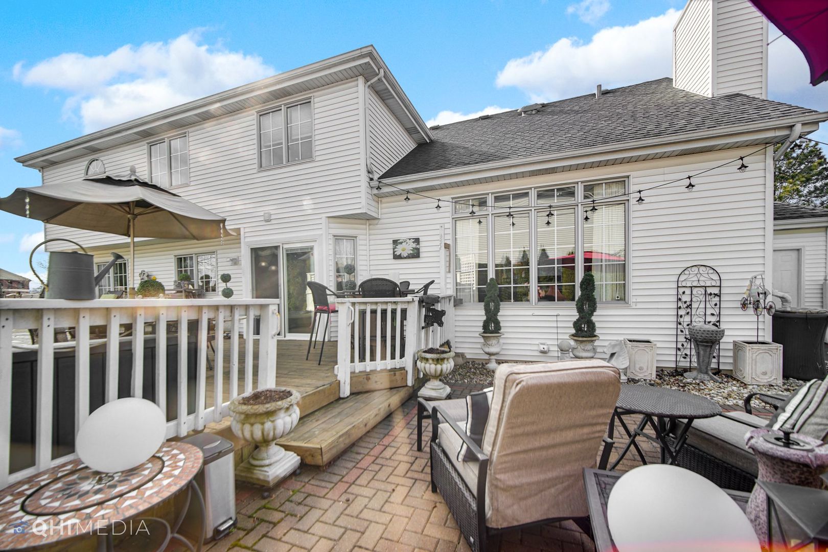 13243 Sunderlin Road Plainfield, IL 60585 - Photo 39 of 40 a balcony with furniture and a potted plant