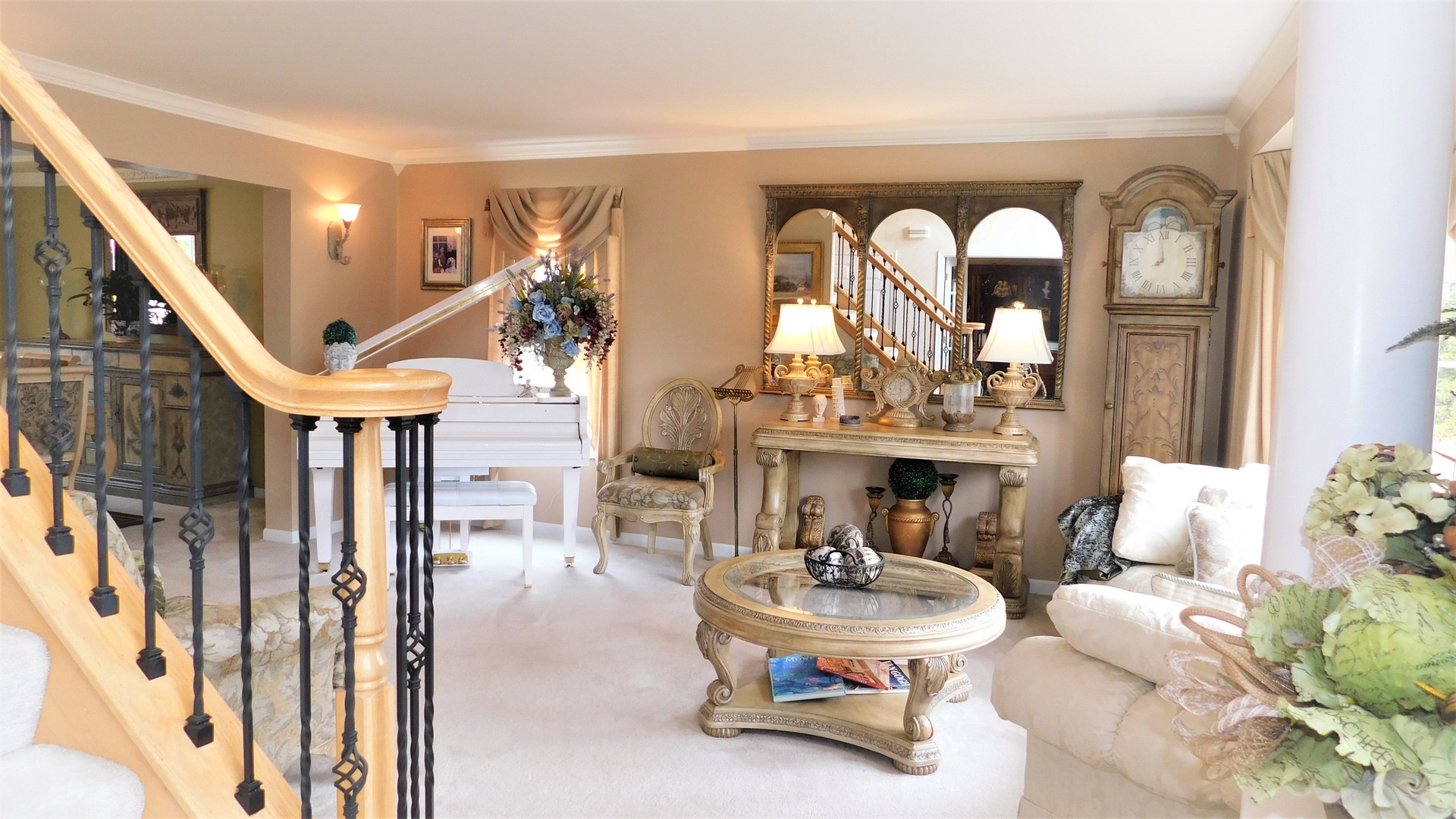 13243 Sunderlin Road Plainfield, IL 60585 - Photo 5 of 40 a living room with furniture a fireplace and a chandelier