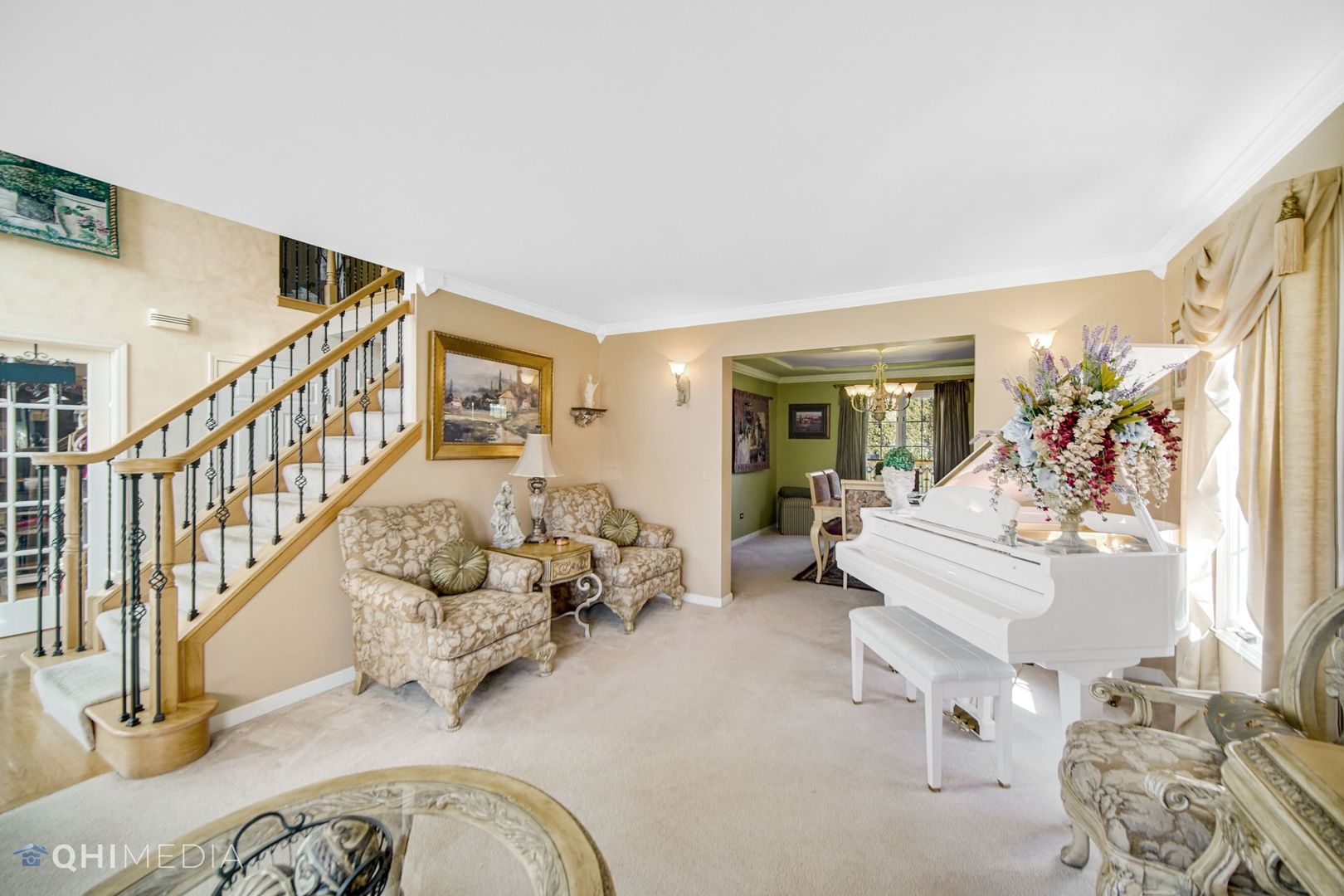 13243 Sunderlin Road Plainfield, IL 60585 - Photo 6 of 40 a living room with furniture and stairs