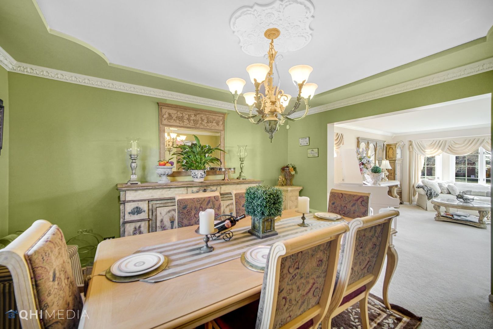 13243 Sunderlin Road Plainfield, IL 60585 - Photo 10 of 40 a view of a dining room with furniture a chandelier and wooden floor