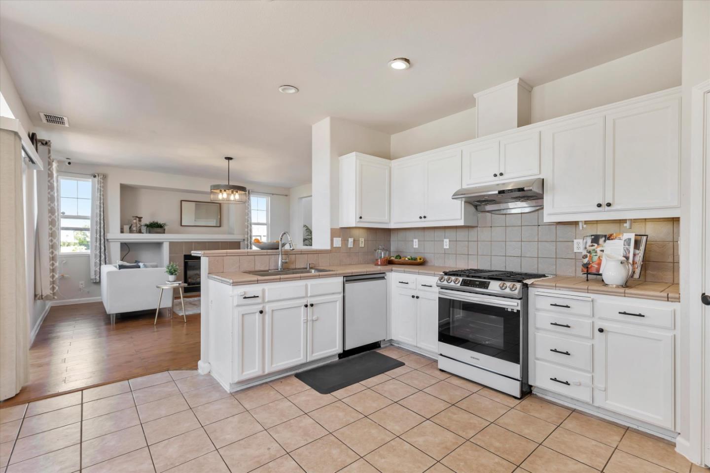252 Comeabout Circle Pittsburg, CA 94565 - Photo 11 of 41 a kitchen with granite countertop white cabinets and appliances