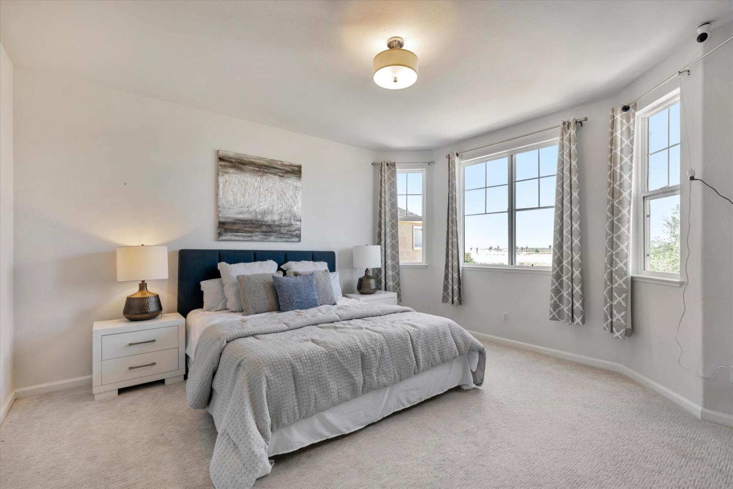 252 Comeabout Circle Pittsburg, CA 94565 - Photo 17 of 41 a bedroom with a large bed and a window