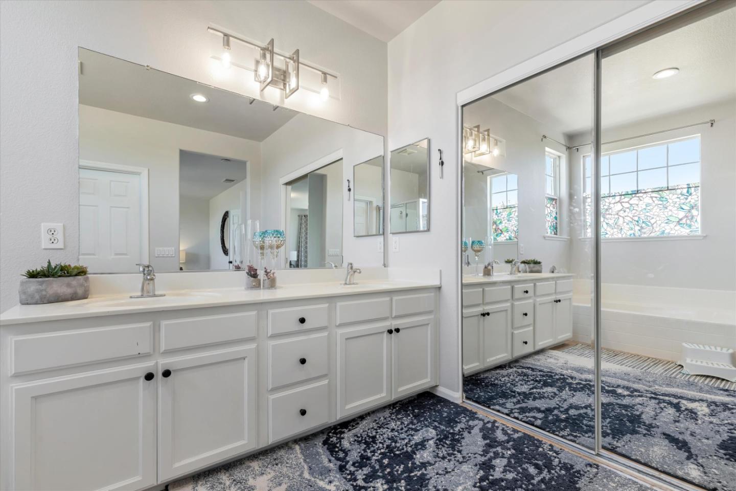 252 Comeabout Circle Pittsburg, CA 94565 - Photo 20 of 41 a spacious bathroom with a double vanity sink a mirror and a shower