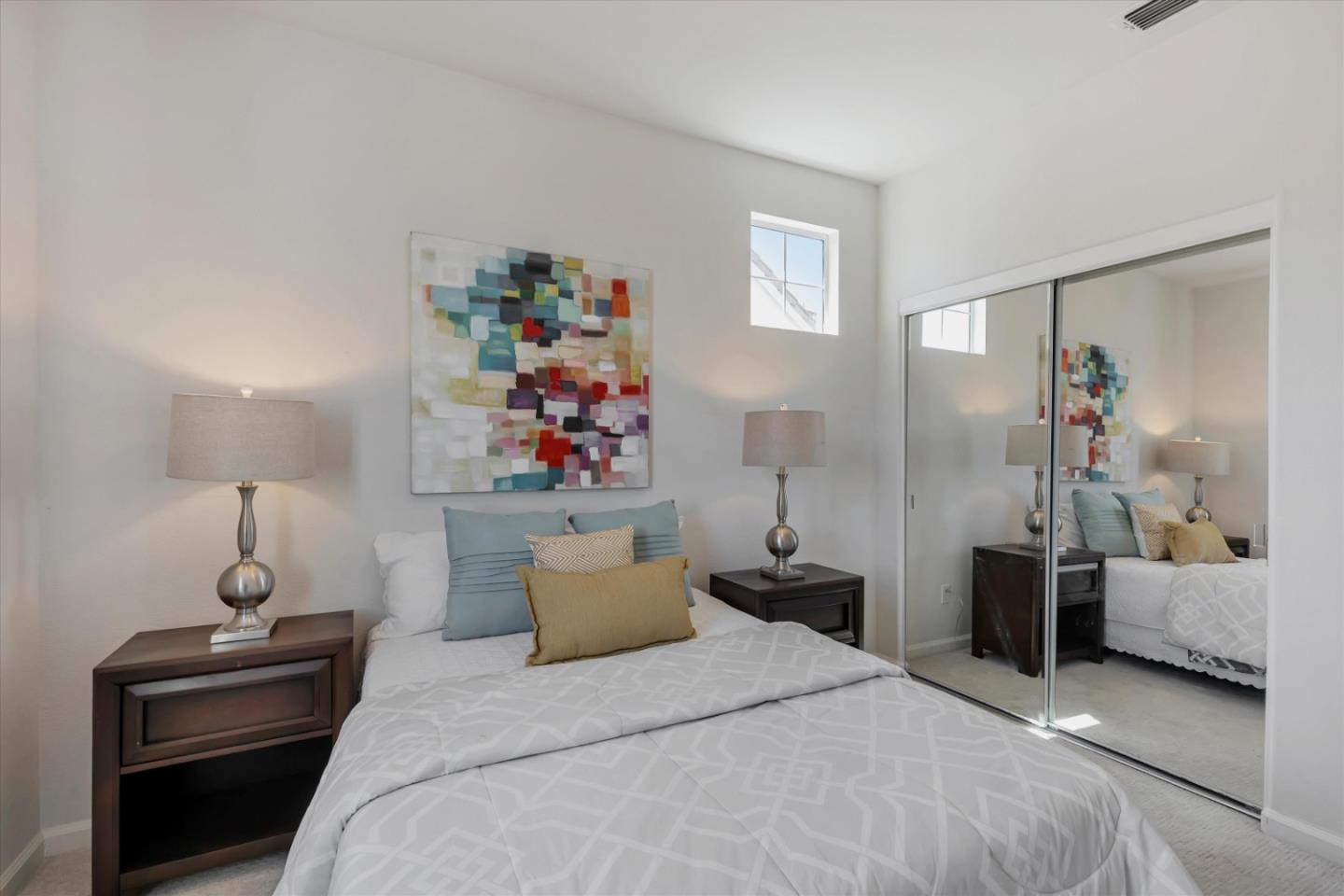 252 Comeabout Circle Pittsburg, CA 94565 - Photo 27 of 41 a bedroom with a bed and a chandelier