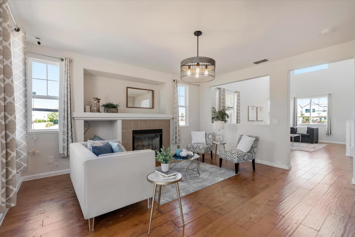 252 Comeabout Circle Pittsburg, CA 94565 - Photo 6 of 41 a living room with furniture and a chandelier