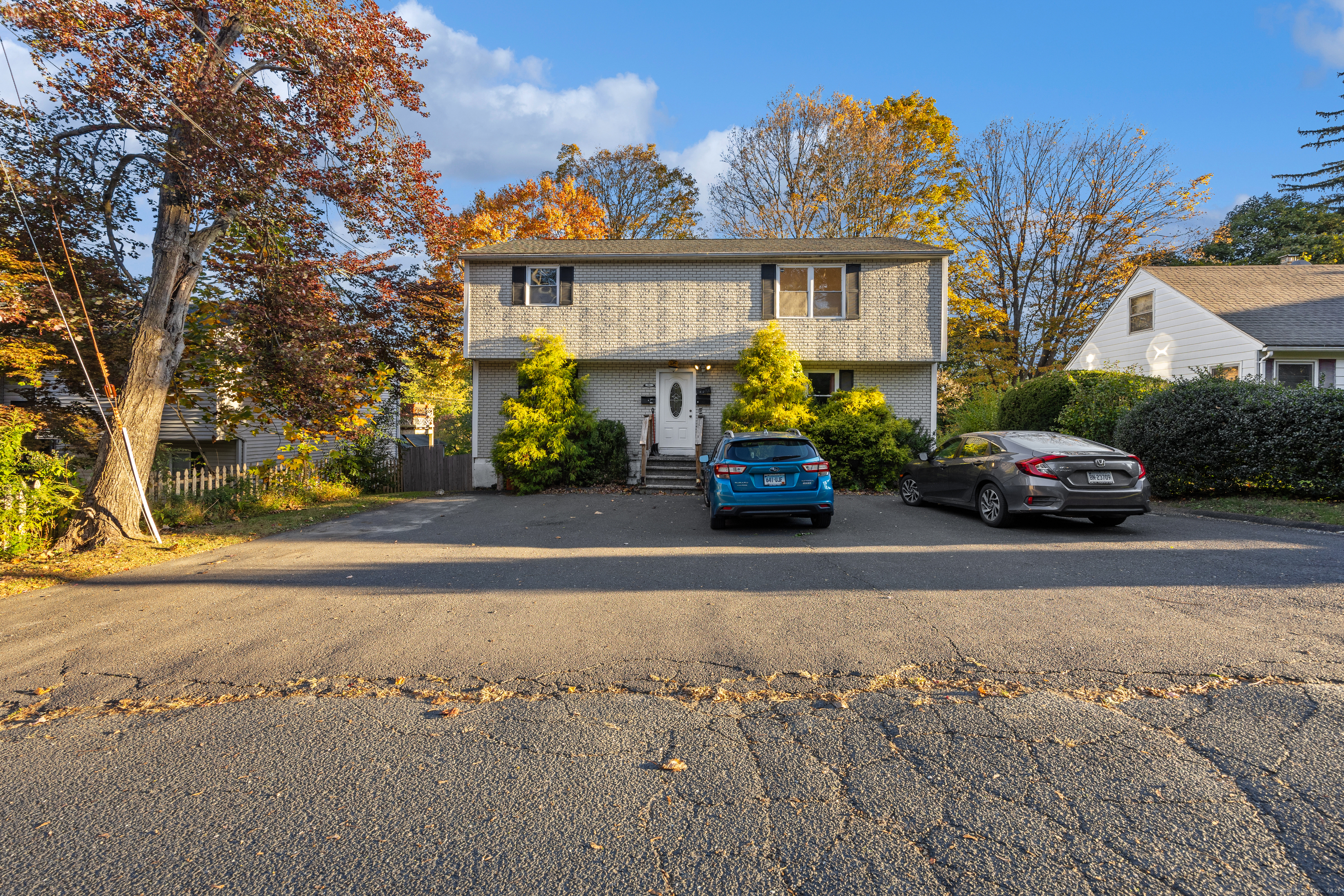 84 Whittier Avenue Waterbury, CT 06708 - Photo 1 of 1 a cars parked in front of a house
